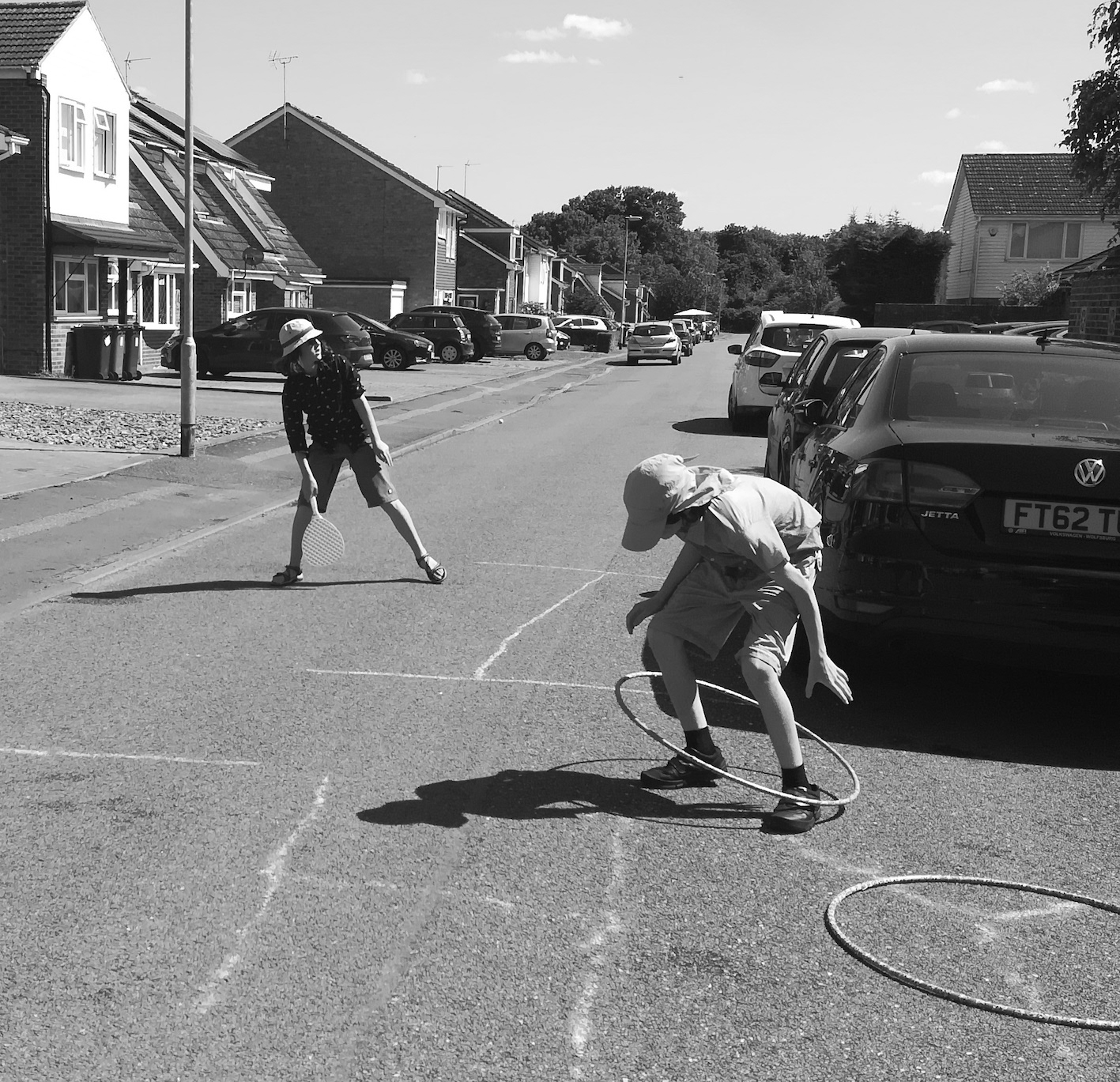 Children playing in the street, by Yasmin Emerson