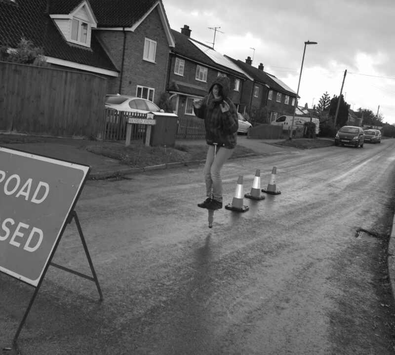 Girl playing in hte street by Yasmin Emerson